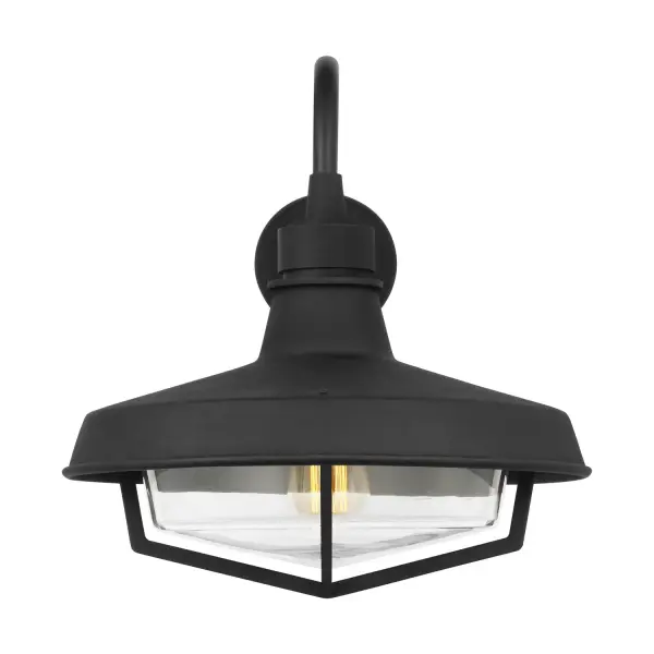 Thomas O'Brien's Hollis sconce reimagines the classic barn light with a contemporary gooseneck silhouette. The textured black steel finish and protective cage design deliver authentic farmhouse character while meeting wet-rated outdoor durability standards.