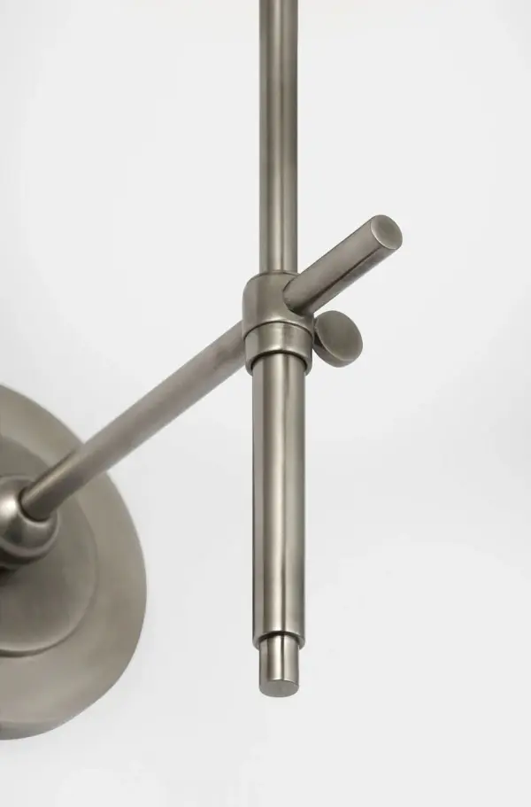 The Bryant 15" Bath Sconce combines classic design with modern convenience. Its cordless feature makes installation flexible, while the antique nickel finish and white glass shade provide sophisticated illumination. - alternate view