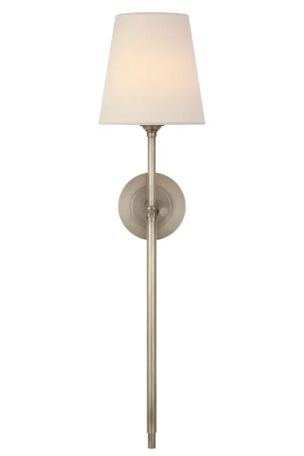 The Bryant 27" Cordless Tail Sconce combines classic design with modern convenience. Its antique nickel finish and linen shade create a sophisticated look, while the cordless feature offers flexible placement without visible wiring.