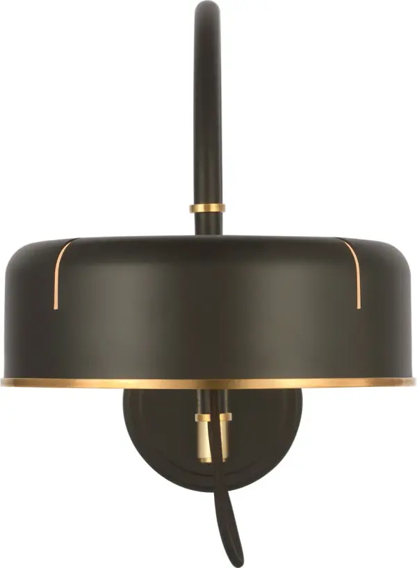 The Oso articulating arc wall light combines functional flexibility with sophisticated mixed-metal finishes. Its adjustable arm allows precise light positioning, making it ideal for reading nooks and task lighting applications.
