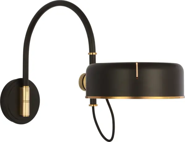 The Oso articulating arc wall light combines functional flexibility with sophisticated mixed-metal finishes. Its adjustable arm allows precise light positioning, making it ideal for reading nooks and task lighting applications. - alternate view