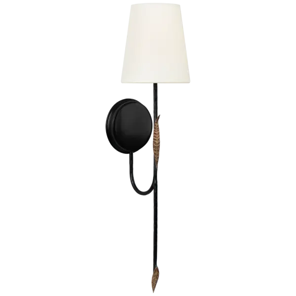 The Kairos 27" Tail Sconce combines aged iron and Roman bronze finishes with a soft linen shade, creating a refined transitional piece. Its substantial 27-inch height makes a statement while providing functional task lighting.