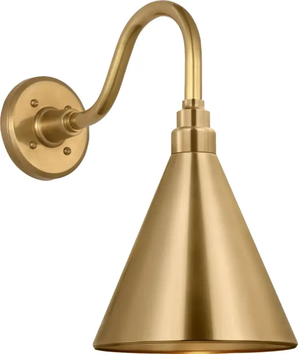 The Flynn Barn Light brings authentic farmhouse charm to outdoor spaces with its hand-rubbed antique brass finish and traditional conical shade. At 11 inches, it's perfectly sized for entryways, porches, and patios. - alternate view