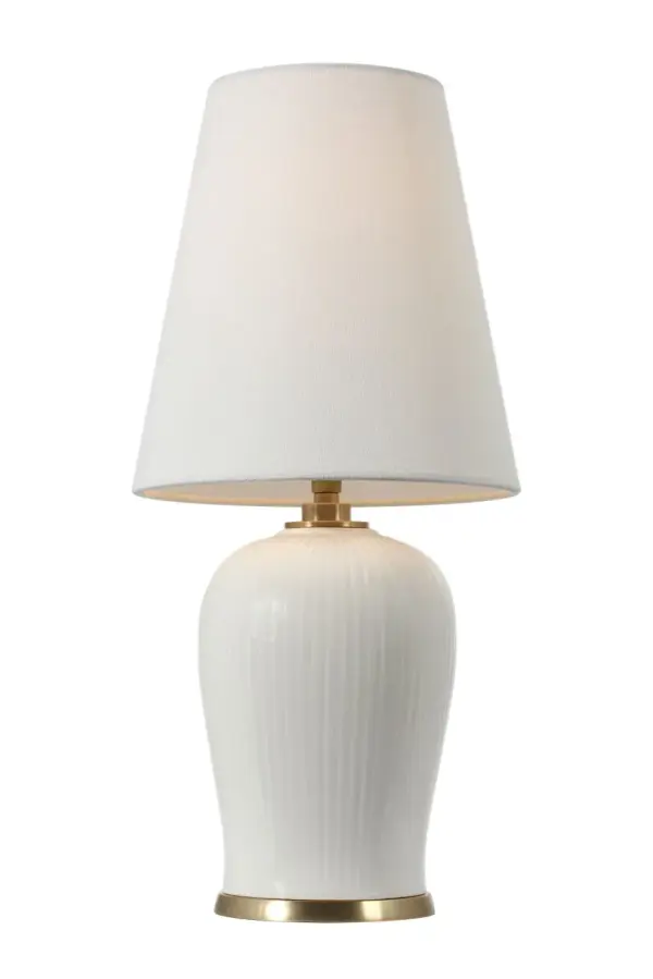 The Opera table lamp brings refined sophistication with its ivory ceramic base and neutral linen shade. At 16 inches, it's perfectly proportioned for bedside tables and accent surfaces, offering warm ambient lighting. - alternate view