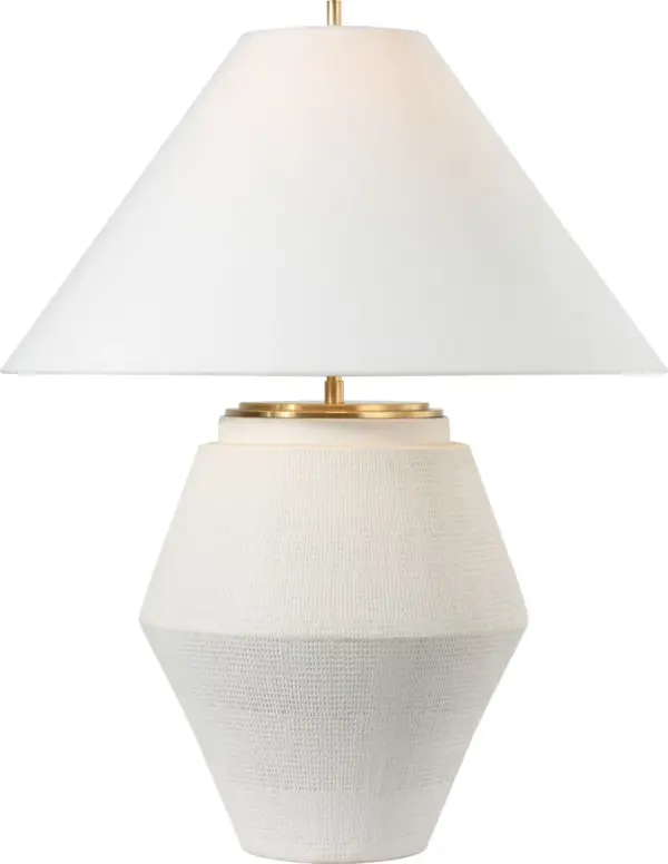 The Aten table lamp combines a sculptural plaster white ceramic base with a classic linen shade, creating a sophisticated lighting solution that works beautifully in both traditional and contemporary settings.