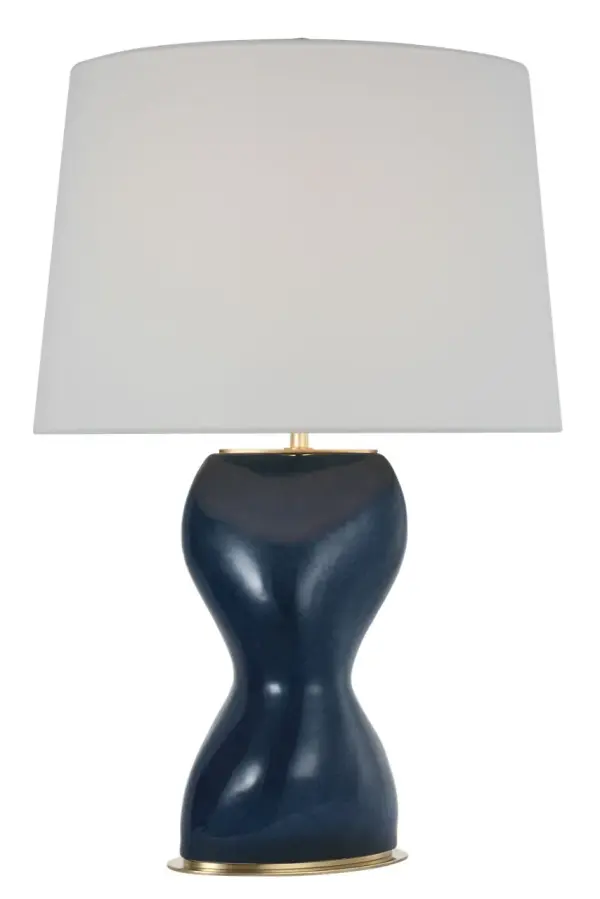 The Misaki 28" table lamp combines organic modern design with a distinctive sandy midnight ceramic base and natural linen shade. Its substantial height and artisanal finish make it ideal for creating ambient lighting in bedrooms and living spaces. - alternate view