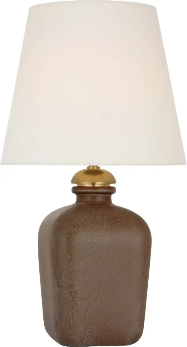 The Josy cordless table lamp combines sophisticated Positano Sand ceramic base with practical wireless functionality. At 17" tall with a linen shade, it delivers ambient lighting anywhere without cord constraints.