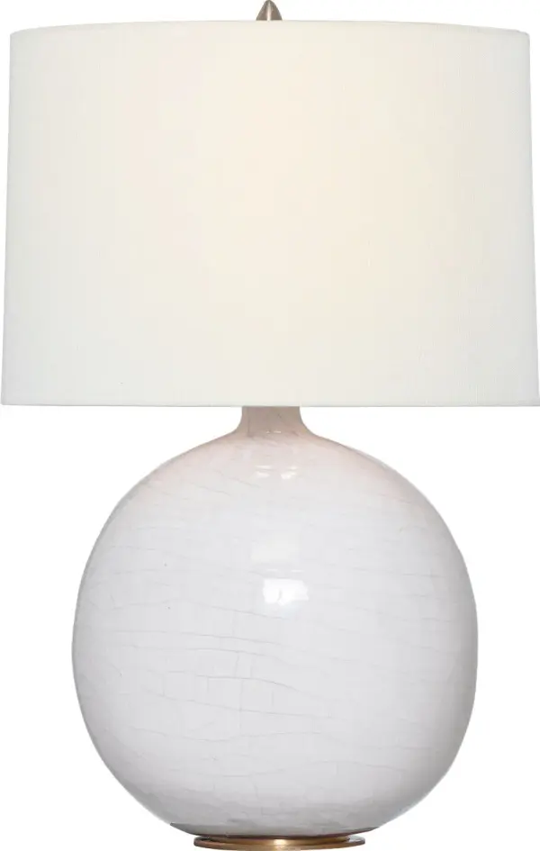 The Sao Paulo table lamp brings sophisticated texture and warmth with its crackled ivory ceramic base and natural linen shade. At 29" tall, it provides substantial presence while maintaining versatility across traditional and contemporary interiors.