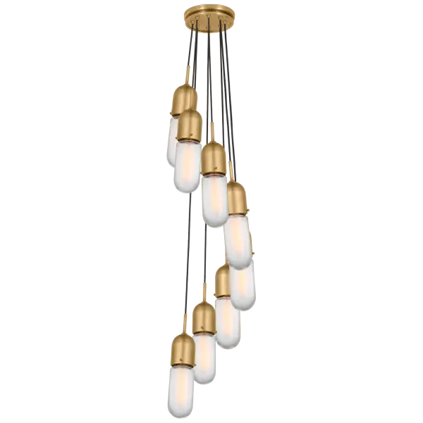 The Junio 8-Light Pendant combines classic hand-rubbed antique brass with contemporary frosted glass shades, creating a versatile fixture that bridges traditional and modern aesthetics. Perfect for large dining spaces and grand entryways. - alternate view