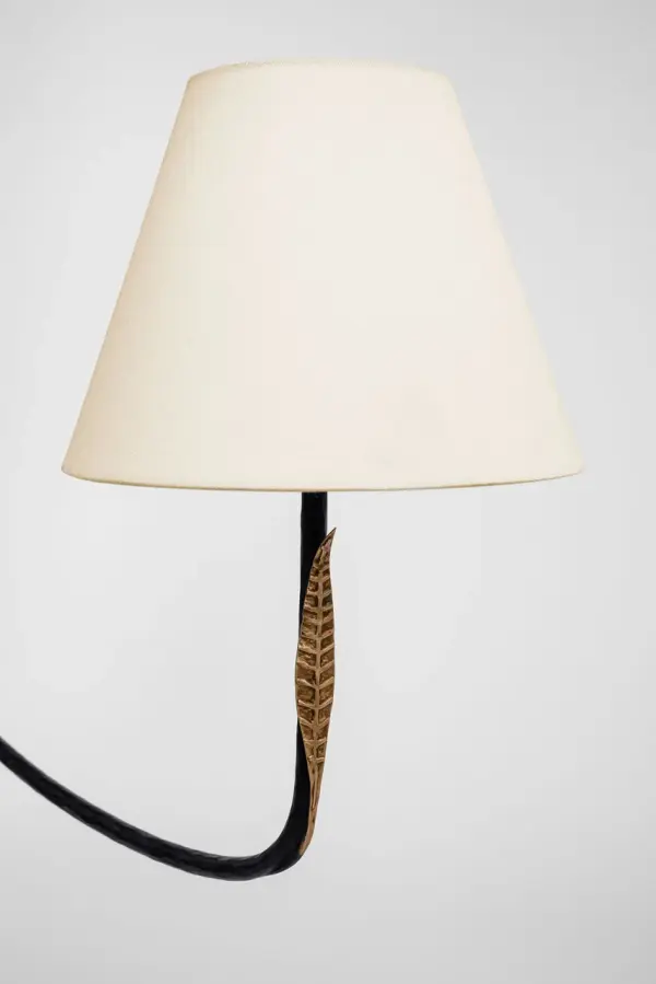 The Kairos 62" Linear Chandelier combines aged iron and Roman bronze finishes with soft linen shades, creating a refined transitional aesthetic. Its substantial length makes it perfect for large dining tables and kitchen islands. - alternate view