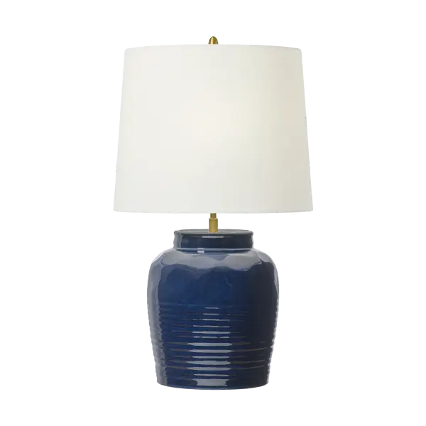 The Selena Medium Table Lamp showcases handcrafted ceramic artistry with a unique mixed blue-brown glaze finish. Its transitional design bridges traditional craftsmanship with contemporary sensibility, making it versatile for coastal, modern, and eclectic interiors.