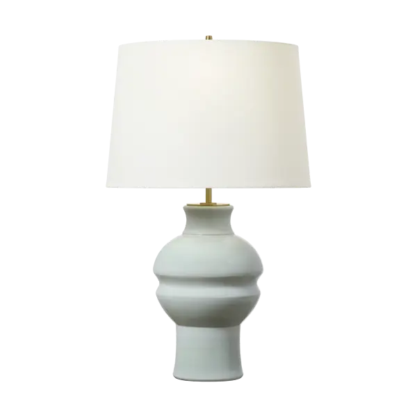 The Nova Medium Table Lamp brings sophisticated style with its unique silk green ceramic base and classic drum shade. Perfect for adding a pop of color while maintaining versatility across contemporary and transitional interiors.