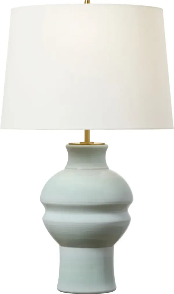 The Nova Medium Table Lamp brings sophisticated style with its unique silk green ceramic base and classic drum shade. Perfect for adding a pop of color while maintaining versatility across contemporary and transitional interiors. - alternate view