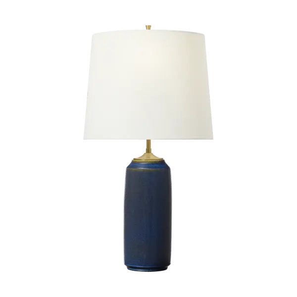 The Cato Medium Table Lamp features a handcrafted ceramic base with a unique mixed blue-brown glaze that adds organic texture and coastal charm to any space. Its medium scale makes it versatile for bedrooms, living areas, and offices.