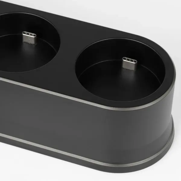 The Quad R45 Universal Charging Station offers a streamlined solution for powering multiple devices simultaneously. Its compact black design fits seamlessly into contemporary interiors while keeping cables organized. - alternate view