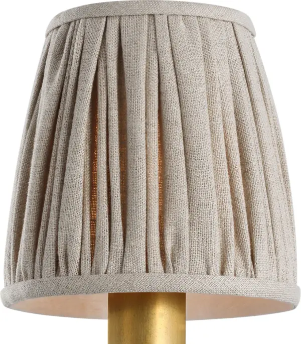 This 4-inch pleated natural linen shade offers an easy, elegant way to refresh existing fixtures. The neutral fabric complements various décor styles while softening light beautifully. - alternate view