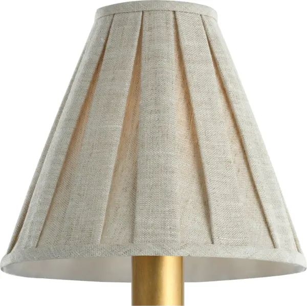 This 6.5" natural linen shade features elegant box pleating and a subtle flare design. The neutral fabric complements various decor styles while adding soft, diffused light to any space.