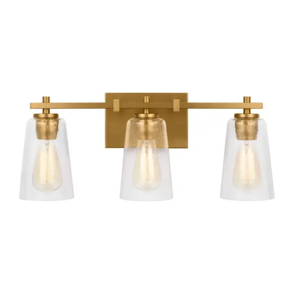The Mercer vanity light combines clean modern lines with warm burnished brass and textured seeded glass. Its 21.5-inch width makes it ideal for medium-sized vanities, while the three-light configuration provides excellent task lighting.
