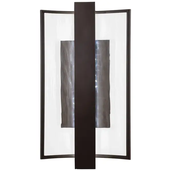 The Sidelight LED Wall Sconce combines transitional styling with modern LED efficiency. Its clear water glass shade and Dorian Bronze finish create sophisticated ambiance while meeting ADA compliance standards.