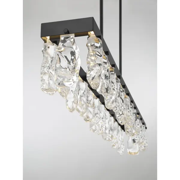 The Artic Glacier brings natural elegance to modern spaces with its striking faux rock crystal shades and sleek coal black finish. At nearly 4 feet long, this LED island light delivers exceptional illumination with 2,420 lumens and superior 92 CRI color rendering. - alternate view