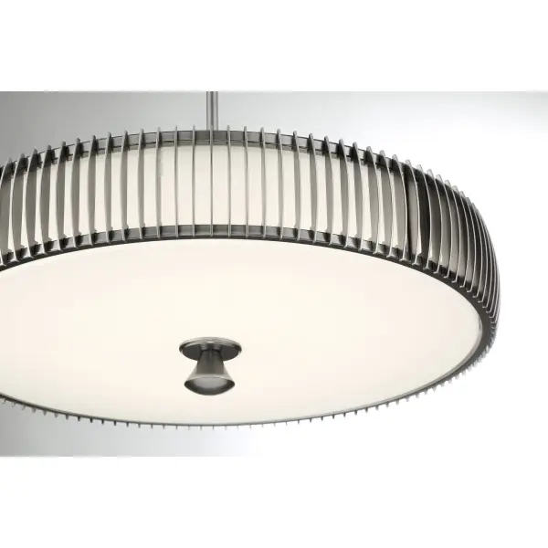 The Night Moves pendant combines modern aesthetics with high-performance LED technology, delivering nearly 5000 lumens with excellent color rendering. Its plated pewter finish and white acrylic shade create a sophisticated look. - alternate view