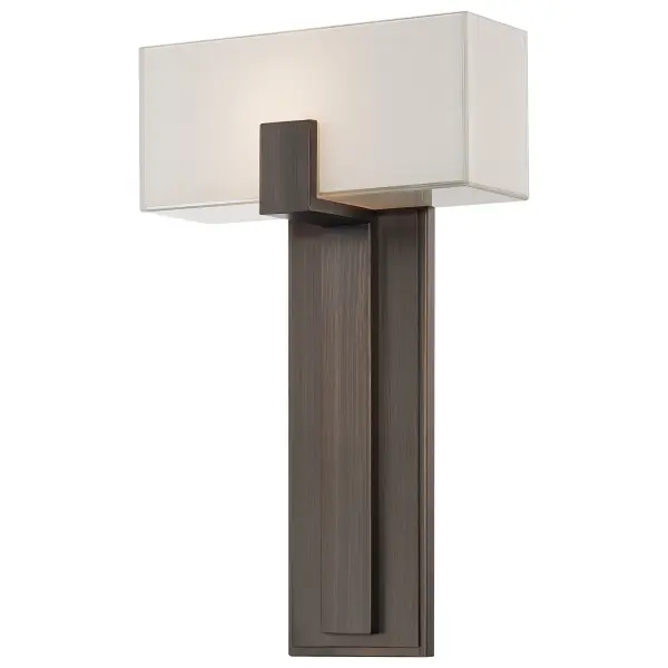 This versatile wall sconce combines transitional styling with practical functionality. The copper bronze patina finish adds warmth while the mitered glass shade with white interior provides soft, diffused lighting. ADA-compliant design makes it ideal for accessible spaces.