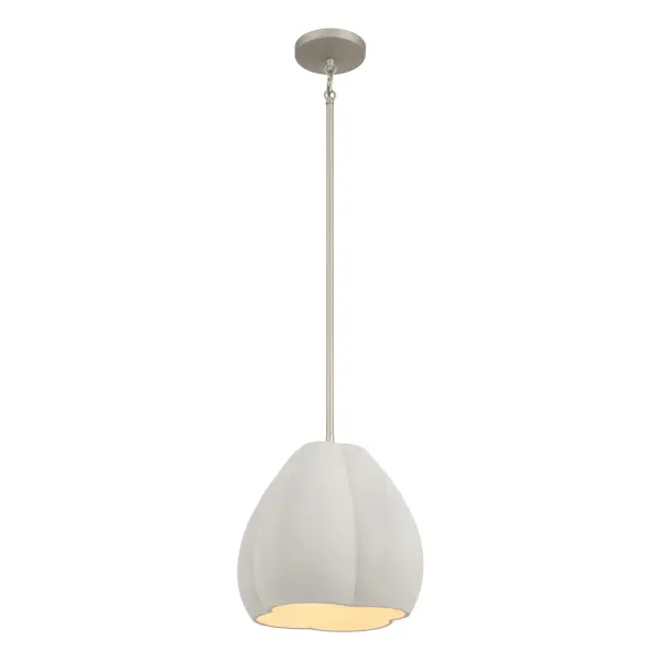 The Sima pendant combines raw cement texture with polished burnished nickel for an industrial-contemporary aesthetic. Its compact 12-inch size makes it ideal for intimate spaces or clustered installations.