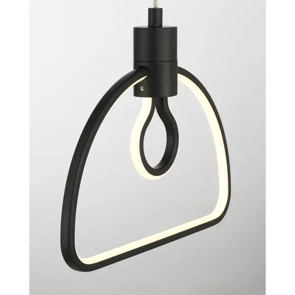 This compact LED pendant combines industrial aesthetics with modern materials, featuring a coal black finish and frosted silicone sleeve. Energy-efficient with excellent color rendering (CRI 92), it delivers focused task lighting in a minimalist package. - alternate view