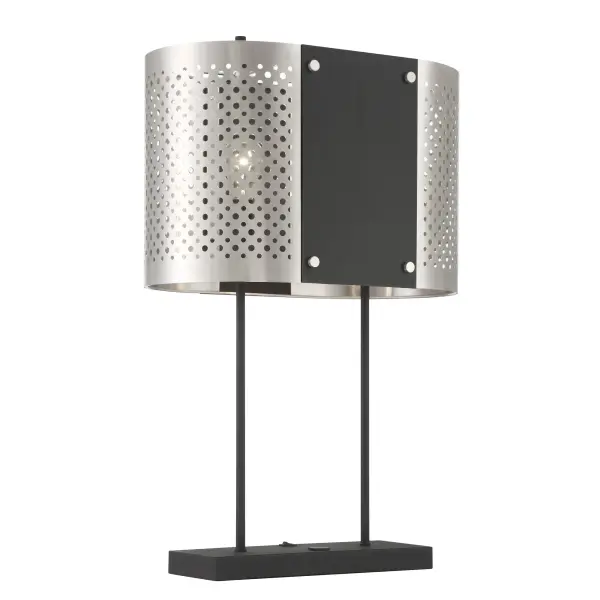 The Noho table lamp by Robin Baron blends contemporary sophistication with industrial edge. Its dual-tone steel construction features brushed nickel accents against coal highlights, creating visual depth and modern appeal.