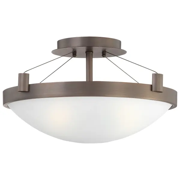 The Suspended semi-flush combines transitional styling with practical functionality. Its copper bronze patina finish adds warmth while frosted glass shades provide even, glare-free illumination perfect for lower ceilings.