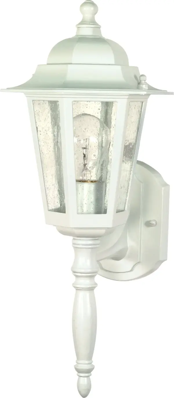 The Central Park wall lantern combines traditional design with clear seeded glass for a welcoming outdoor aesthetic. At 18 inches, it provides substantial presence while the white finish offers versatile coordination.