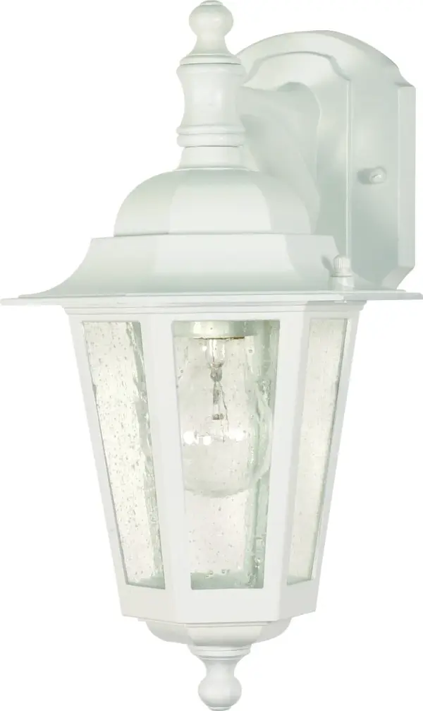 The Cornerstone wall lantern brings timeless appeal to outdoor spaces with its clean white finish and textured seeded glass. At 13 inches, it's perfectly sized for entryways, porches, and patios, offering reliable illumination with traditional charm.