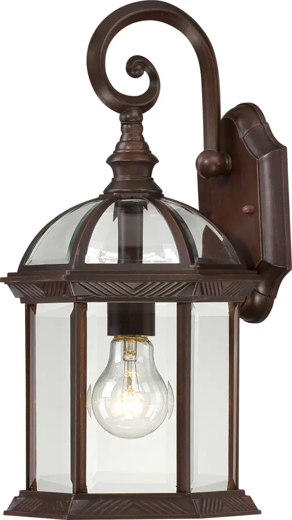 The Boxwood outdoor wall sconce combines traditional design with durable construction, featuring clear beveled glass that beautifully diffuses light. At 15 inches, it provides substantial illumination for entryways and outdoor spaces.
