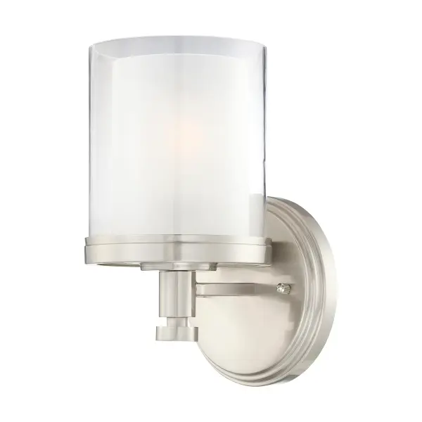 The Decker vanity fixture combines machined industrial style with a distinctive double glass shade that creates depth and ambient glow. Its brushed nickel finish and clear/frosted glass pairing work seamlessly with modern and transitional bathrooms.
