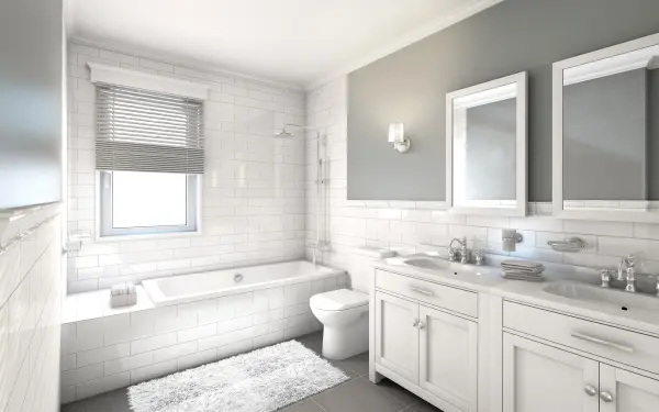 The Decker vanity fixture combines machined industrial style with a distinctive double glass shade that creates depth and ambient glow. Its brushed nickel finish and clear/frosted glass pairing work seamlessly with modern and transitional bathrooms. - alternate view