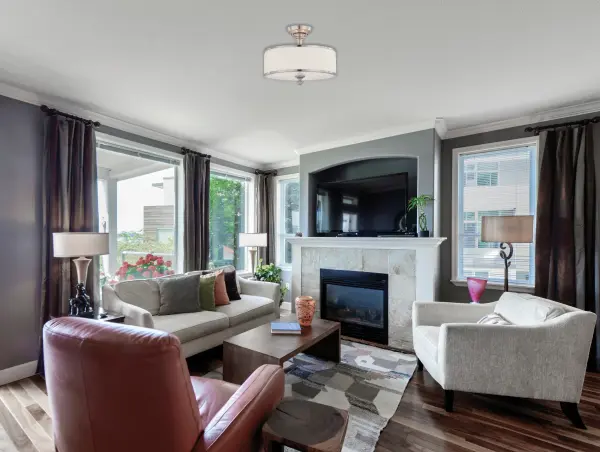 The Candice semi-flush mount beautifully bridges traditional chandelier elegance with contemporary finishes. Its brushed nickel frame and pleated white fabric shades create soft, diffused lighting perfect for intimate spaces. - alternate view