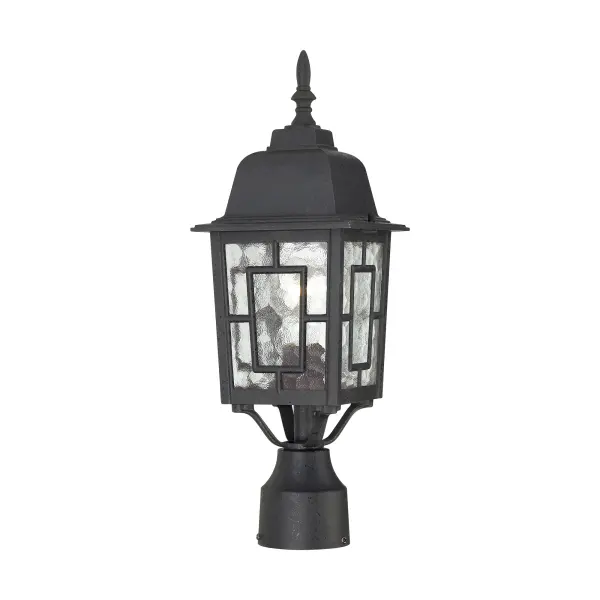 The Banyan outdoor post lantern combines geometric architectural details with clear water glass for a sophisticated exterior lighting solution. Its textured black finish and handsome design make it versatile for both traditional and contemporary homes.