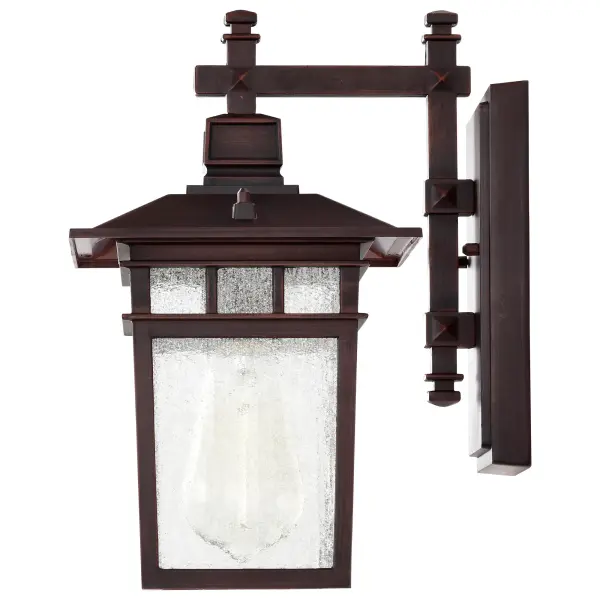 The Cove Neck wall lantern offers a unique fusion of Eastern-inspired design with classic Americana styling. Its rustic bronze finish and clear seeded glass create sophisticated curb appeal at an accessible price point. - alternate view