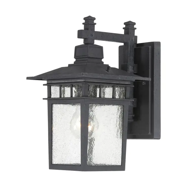 The Cove Neck wall lantern offers a unique fusion of Eastern-inspired design with classic Americana styling. Its textured black finish and clear seed glass create sophisticated curb appeal at an accessible price point.