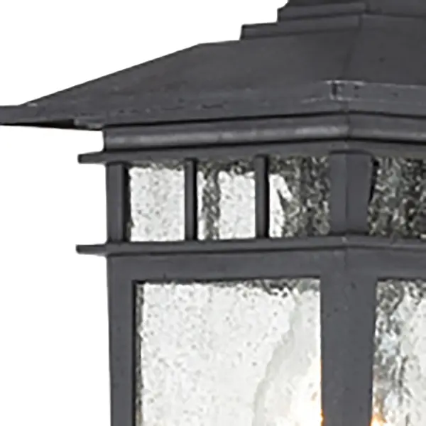 The Cove Neck wall lantern offers a unique fusion of Eastern-inspired design with classic Americana styling. Its textured black finish and clear seed glass create sophisticated curb appeal at an accessible price point. - alternate view