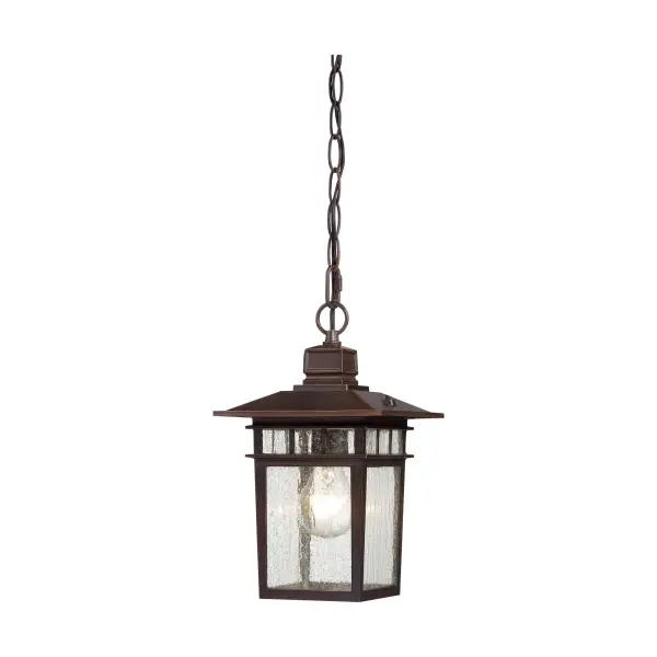 The Cove Neck lantern blends Eastern-inspired design with American farmhouse charm, creating a distinctive outdoor lighting solution. Its rustic bronze finish and clear seeded glass deliver both character and curb appeal.