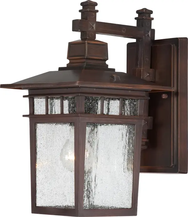 The Cove Neck outdoor wall lantern combines traditional design with rustic bronze finish and clear seeded glass for elegant exterior lighting. Perfect for illuminating entryways, porches, and pathways with timeless style.