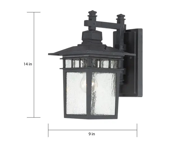 The Cove Neck outdoor wall lantern combines contemporary styling with classic lantern form. Its textured black finish and clear seeded glass create visual interest while providing reliable outdoor illumination. - alternate view
