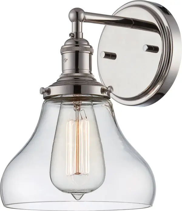 This polished nickel wall sconce combines contemporary styling with vintage appeal through its exposed ST19 bulb and clear glass shade. The up-or-down mounting flexibility makes it adaptable for various spaces.