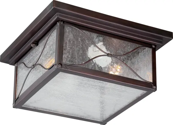 The Vega outdoor flush mount combines traditional bronze styling with textured seeded glass for a timeless look. Perfect for porches, entryways, and covered patios where classic elegance meets practical illumination.