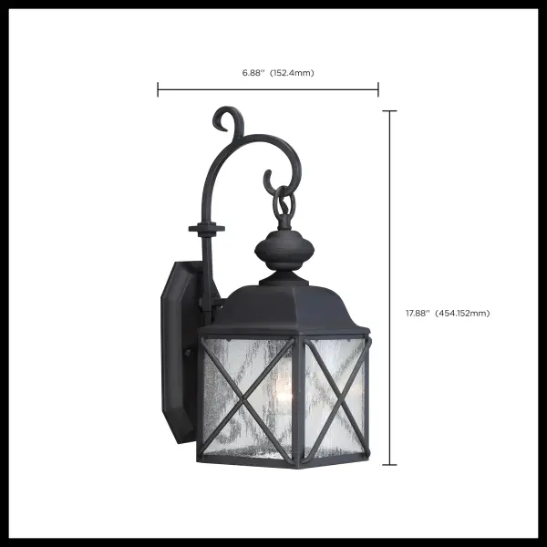 The Wingate outdoor wall fixture combines contemporary style with classic charm. Its textured black finish and clear seeded glass create visual interest while providing reliable illumination for entryways, porches, and pathways. - alternate view