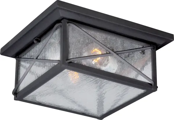 The Wingate outdoor flush mount combines contemporary elegance with practical outdoor lighting. Its textured black finish and clear seeded glass create visual interest while providing reliable illumination for porches, stoops, and pathways.