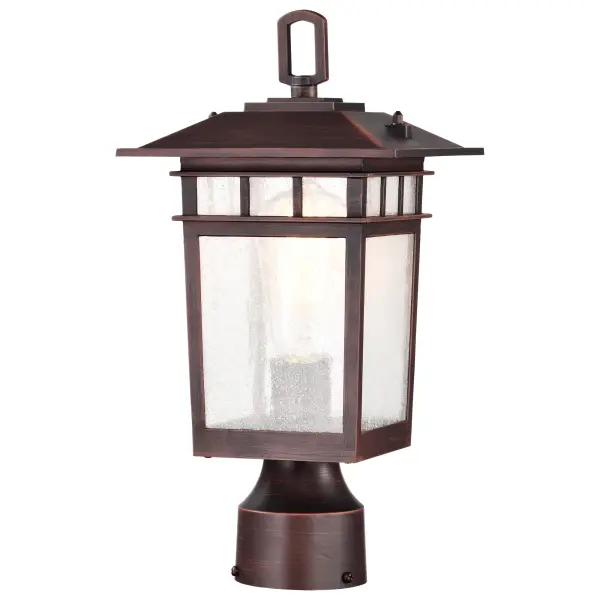 The Cove Neck post light combines classic craftsman design with modern versatility. Its die-cast aluminum construction and rustic bronze finish complement various architectural styles, while clear seeded glass creates ambient lighting perfect for pathways and entryways.