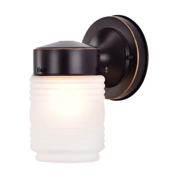 This compact outdoor wall sconce features an iconic mason jar silhouette with frosted ribbed glass that softly diffuses light. The mahogany bronze finish adds warmth and rustic character, making it perfect for porches, entryways, and patios. - alternate view