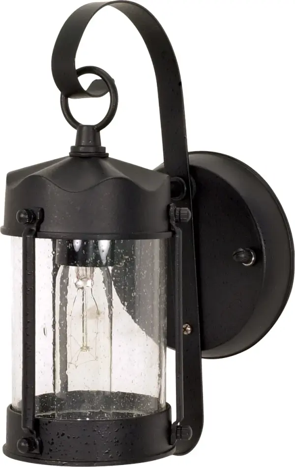 The Piper Wall Lantern delivers timeless style at an exceptional value. Its textured black finish and clear seeded glass create visual interest while providing reliable outdoor illumination for entryways and porches.